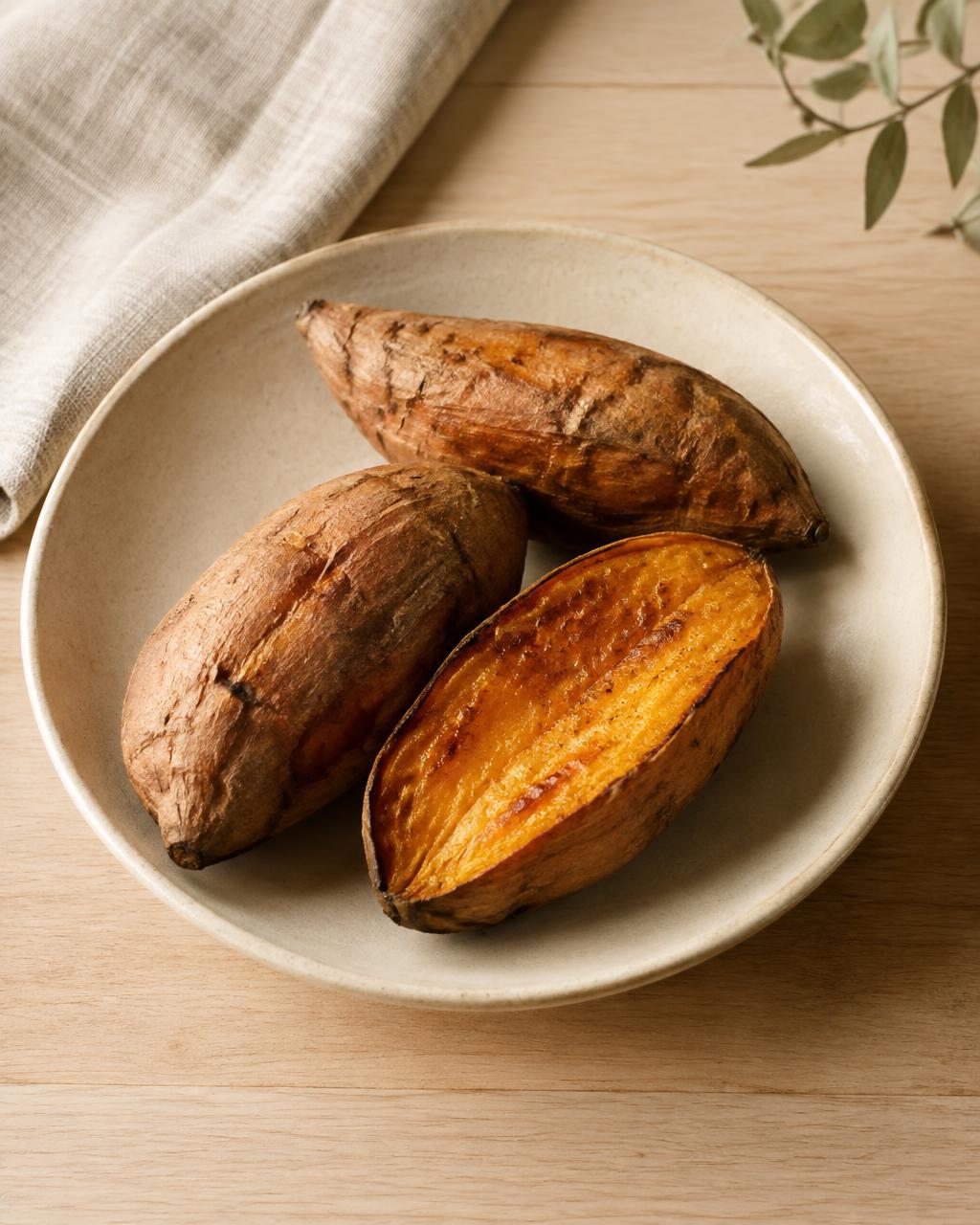 Roasted sweet potatoes in a cream ceramic dish